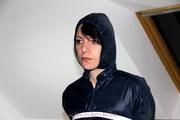 Simone tied and gagged in a shiny nylon rainsuit and a shiny nylon cape