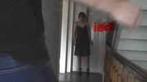 Kim tied to the door