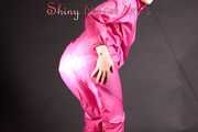 Mara wearing a sexy pink rainsuit posing infront of the camera in a studio (Pics)