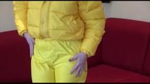 Jill ties, gagges and hoodes herself wearing a shiny yellow down jacket and a yellow rain pants(Video)