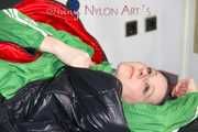 Lucy wearing sexy green shiny nylon shorts and a green rain jacket lolling on bed with a special cover (Pics)