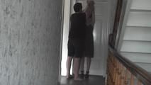 Kim tied to the door