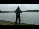 Enni wearing shiny nylon shorts and a rain jacket as well as a rain pants over the shorts (Video)