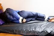 Shelly tied and gagged in shiny nylon pants and a shiny nylon dowjacket