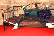 Mara tied and gagged on a princess bed in an old cellar wearing an supersexy shiny green down jacket and a rain pants (Pics)