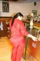 Jill posing sexy in an bar wearing sexy red shiny nylon rainwear (Pics)
