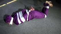 Sexy Sandra wearing a supersexy purple shiny nylon rainsuit bein tied and gagged and hooded on the floor with tape (Video)