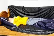 Samanthy bound and gagged in shiny nylon rainwear