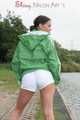 Watching ***OUR SEXY ARCHIVE MODEL JENNY*** wearing a sexy white shiny nylon shorts and a green shiny nylon rain jacket posing for you (Pics)