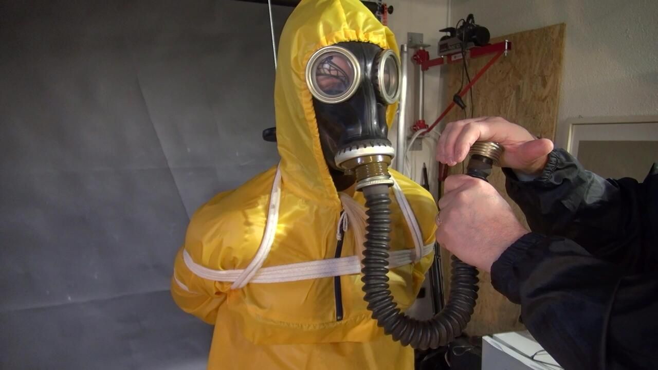 Watch Lady M Bound In A Yellow Rainsuit Wearing A Latex Hood And A Gasmask