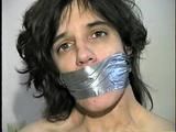 26 Yr OLD K-MART CLERK WRAP TAPE GAGGED WEARING BATHING CAP, MOUTH STUFFED. TIT TIED, CROTCH ROPED, NUDE, GARTER BELT & NYLON STOCKINGS TIGHTLY TIED TO A CHAIR (D63-13)