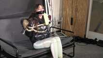 Marie bound and gagged in a shiny nylon Downjacket