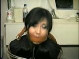30 YR OLD ASIAN LI-JUN IS CLEAVE GAGGED, TIED TO CHAIR, LOTS OF WIDE EYED GAG TALKING (D52-11)