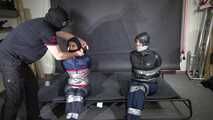 Aiyana and Ms Ungeniert bound and gagged in shiny nylon Rainwear