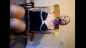 Tied up and gagged in a rocking chair