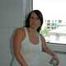 Benita taking a hot shower in a white undershirt and stockings
