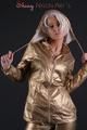 Blonde archive girl posing in a studio wearing a sexy golden rainwear combination (Pics)