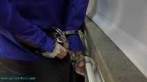 Leather lady cuffed to the heater