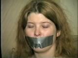 ONE IS STOCKING GAGGED, WET WRISTS GAGGED, BAREFOOT, TOE-TIED, GAGS HERSELF & IS HANDGAGGED (D43-12)