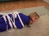 Gina in blue Lycra catsuit