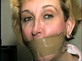 44 Yr OLD HOUSEKEEPER ON SCREEN HOG-TYING, MOUTH STUFFING, FEET AND LEG TAPE TYING WEARING PANTYHOSE, & WRAP TAPE GAGGING (D56-13)