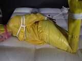 Watch Pia enjoying Bondage in her shiny nylon yellow Rainwear