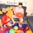 Jill and a friend of her wearing shiny nylon shorts and rain jacket playing with baloons (Pics)