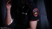 Police woman is smoking 3 strong reds in the studio