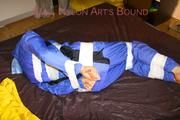 Lucy taped, hooded and gagged on bed wearing sexy blue rainwear (Pics)