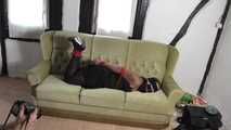 Jasmin hogtied on couch 2/2