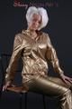Blonde archive girl posing in a studio wearing a sexy golden rainwear combination (Pics)