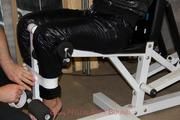 Katharina tied and gagged in a shiny nylon downcoat and shiny nylon pants