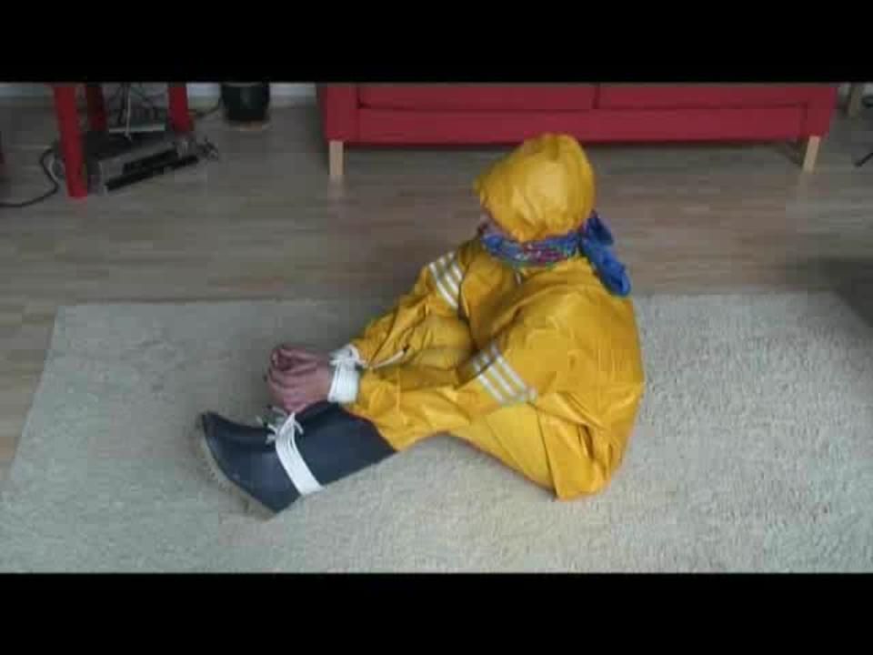03:20 Min. Video With Katharina Bound In A Yellow Rainsuit