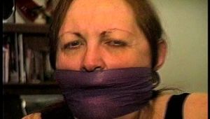 46 Yr OLD REAL ESTATE AGENT'S IS MOUTH STUFFED, HANDGAGGED, CLEAVE AND OTM VET TAPE GAGGED, BALL-GAGGED, CLEAR TAPE GAGGED WITH HANDS TIGHTLY TIED WITH THIN RAWHIDE (D72-5)