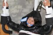 Katharina tied and gagged in a shiny nylon downcoat and shiny nylon pants