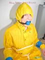 Katharina tied, gagged and hooded on a chair wearing sexy yellow rainwear (Pics)