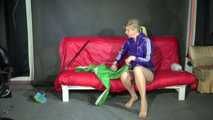 Watching sexy Pia wearing a supersexy shiny nylon shorts and rain jacket cleaning the studio (Video)