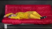 Watching Mara putting on sexy yellow shiny nylon rainwear lolling on the sofa (Video)