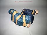 One of our archive girls tied and gagged in shiny nylon rainwear