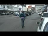 Alina walking on the street cruising around wearing sexy shiny nylon shorts under her jeans and a rain jacket (Video)