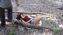 Nelly tied between two trees 1/2