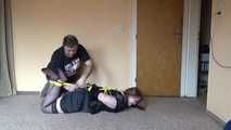Hogtied in yellow ropes