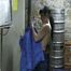 Jill in a cold room wearing shiny nylon rain pants and a down jacket (Video)