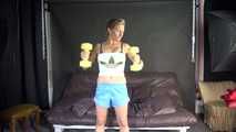 Watching sexy Sandra wearing a sexy lightblue shiny nylon shorts and a white top during her workout with barbells (Video)