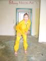 Leonie wearing a super sexy yellow rainwear combination posing outdoor (Pics)