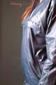Alina posing in a studio wearing a supersexy darkblue rainwear combination (Pics)