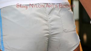 Stella tied and gagged outdoor on a stairway wearing a sexy shiny nylon shorts and a top (Pics)