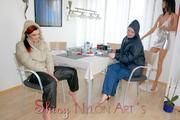 Jill and a friend of her enjoying a cup of coffee, smoking cigarettes at home while wearing supersexy blue and white rain- and downwear (Pics)
