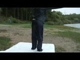 Enni wearing shiny nylon shorts and a rain jacket as well as a rain pants over the shorts (Video)