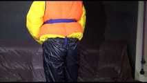 Watching Mara putting on a down jacket, rubber boots and a lifevest (Video)
